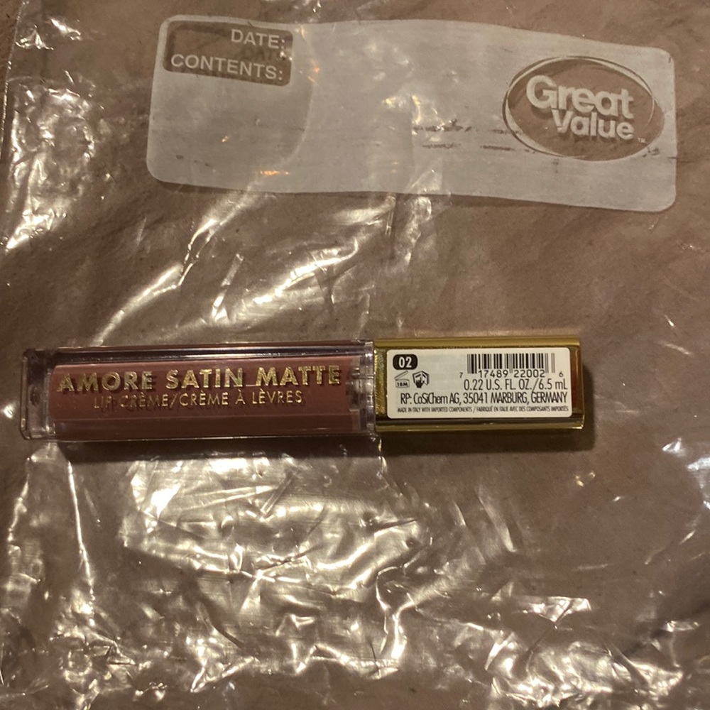 Milani lip gloss/balm completely new unopened